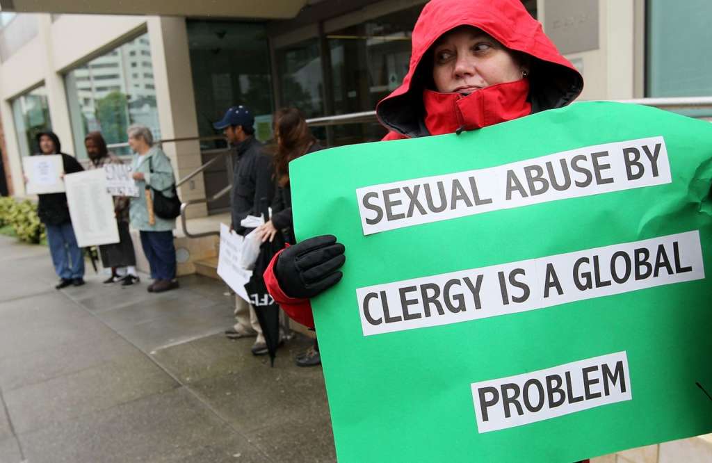 SAN FRANCISCO - MARCH 29: Melanie Sakoda holds a sign as she participates in a demonstration with members of the group SNAP, the Survivors Network of those Abused by Priests, outside of the offices of the San Francisco Archdiocese March 29, 2010 in San Francisco, California. Members of the group SNAP held a demonstration outside the San Francisco Archdiocese in protest of Pope Benedict XVI who allegedly played a leading role in a cover-up of child sex abuse by Roman Catholic priests when he was a Cardinal. (Photo by Justin Sullivan/Getty Images)